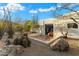 Backyard patio featuring desert landscaping, gravel and a private seating area at 7451 E Long Rifle Rd, Carefree, AZ 85377