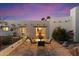 Charming backyard patio with outdoor dining set and lush landscaping, perfect for entertaining at 7451 E Long Rifle Rd, Carefree, AZ 85377