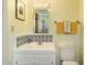 Bright bathroom with yellow accents, featuring a tile countertop and patterned decorative tiles at 7451 E Long Rifle Rd, Carefree, AZ 85377