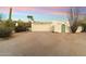 Desert home boasts natural desert landscaping and an attached two car garage at 7451 E Long Rifle Rd, Carefree, AZ 85377