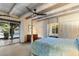 Serene main bedroom featuring exposed beam ceilings, walkout patio, and ample natural light at 7451 E Long Rifle Rd, Carefree, AZ 85377