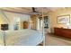 Bright main bedroom showcasing an en suite, beamed ceilings, and a walkout to the patio at 7451 E Long Rifle Rd, Carefree, AZ 85377