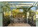 Outdoor patio with pergola, table, and view of lush garden at 7451 E Long Rifle Rd, Carefree, AZ 85377