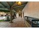 Inviting covered patio featuring beautiful tile flooring, exposed beams, and an outdoor view of the pool at 7451 E Long Rifle Rd, Carefree, AZ 85377