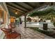 Tranquil patio area with a pool, fountain, and lounge chairs at 7451 E Long Rifle Rd, Carefree, AZ 85377
