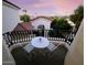 Cozy balcony with a small table and chairs, offering a pleasant outdoor space and neighborhood views at 7667 E Krall St, Scottsdale, AZ 85250