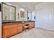 Bathroom with dual sink vanities, lots of cabinets, and tile flooring at 7667 E Krall St, Scottsdale, AZ 85250