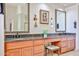 Bathroom vanity features granite counters, dual sinks, and wall mirrors at 7667 E Krall St, Scottsdale, AZ 85250