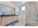Bathroom with a glass enclosed shower, soaking tub, and double vanity at 7667 E Krall St, Scottsdale, AZ 85250