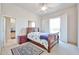 Bedroom featuring a ceiling fan, sliding glass door, and ensuite bath at 7667 E Krall St, Scottsdale, AZ 85250