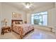 Bedroom area featuring neutral tile flooring, a ceiling fan, and shutters at 7667 E Krall St, Scottsdale, AZ 85250