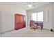 Bedroom area with a ceiling fan, office area, and window with shutters at 7667 E Krall St, Scottsdale, AZ 85250