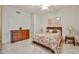 Bedroom area featuring neutral tile flooring, a ceiling fan, and 2 dressers at 7667 E Krall St, Scottsdale, AZ 85250