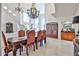 Elegant dining room with a chandelier and large table perfect for entertaining at 7667 E Krall St, Scottsdale, AZ 85250