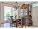 Dining room with chandelier, decorative cabinet, and sliding glass doors to covered outdoor space at 7667 E Krall St, Scottsdale, AZ 85250