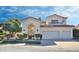 Elegant two-story home featuring arched entry, tile roof, and a two-car garage at 7667 E Krall St, Scottsdale, AZ 85250