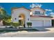 Elegant two-story home with a private gated courtyard, two car garage, and red tile roof at 7667 E Krall St, Scottsdale, AZ 85250