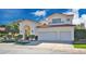 Elegant two-story home with a private gated courtyard, two car garage, and red tile roof at 7667 E Krall St, Scottsdale, AZ 85250