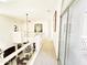 Bright hallway overlooks the dining room with beautiful railings and artwork at 7667 E Krall St, Scottsdale, AZ 85250