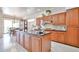 Kitchen featuring granite countertops, wood cabinets, and a kitchen island at 7667 E Krall St, Scottsdale, AZ 85250
