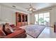 Spacious living room with area rug, built-in shelving, and outdoor access at 7667 E Krall St, Scottsdale, AZ 85250