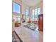 Bright living room featuring soaring ceilings, a fireplace, large windows and elegant decor at 7667 E Krall St, Scottsdale, AZ 85250