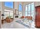 Spacious living room featuring high ceilings, fireplace, and ample natural light at 7667 E Krall St, Scottsdale, AZ 85250