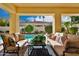 Outdoor living space featuring comfortable seating with a view of a backyard pool and garden at 7667 E Krall St, Scottsdale, AZ 85250