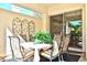 Charming patio with a table set with seating for four and sliding glass door access to the house at 7667 E Krall St, Scottsdale, AZ 85250