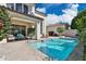 Beautiful backyard featuring a sparkling pool, covered patio, and lush landscaping at 7667 E Krall St, Scottsdale, AZ 85250