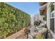 Charming backyard patio with lush landscaping, cozy seating, string lights, and peaceful ambiance at 77 E Missouri Ave # 7, Phoenix, AZ 85012