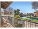 Scenic balcony view overlooking a tranquil pond with lush greenery and well-maintained pathways at 77 E Missouri Ave # 7, Phoenix, AZ 85012