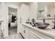 Bathroom featuring decorative vessel sink on a quartz countertop and modern fixtures at 77 E Missouri Ave # 7, Phoenix, AZ 85012