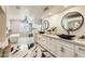 Elegant bathroom with dual vanities, a freestanding tub, and modern design elements at 77 E Missouri Ave # 7, Phoenix, AZ 85012