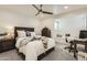 Comfortable bedroom with ceiling fan, study and window bench that allows for natural light at 77 E Missouri Ave # 7, Phoenix, AZ 85012