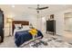 Bedroom with sliding barn door and ensuite bathroom featuring modern finishes and fixtures at 77 E Missouri Ave # 7, Phoenix, AZ 85012