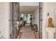 Charming courtyard entryway with manicured greenery, custom lighting, and a secure gated entrance at 77 E Missouri Ave # 7, Phoenix, AZ 85012