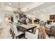An open floorplan dining room with dark wood accents, and a spiral staircase in the background at 77 E Missouri Ave # 7, Phoenix, AZ 85012