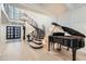 Elegant entrance with a grand staircase, piano, and wood flooring at 77 E Missouri Ave # 7, Phoenix, AZ 85012