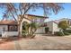 Stunning two-story home featuring a red tile roof, balcony, two car garage, and beautifully landscaped yard at 77 E Missouri Ave # 7, Phoenix, AZ 85012