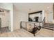 Upstairs hallway featuring modern black railings and an open view to the kitchen below at 77 E Missouri Ave # 7, Phoenix, AZ 85012