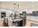 Modern kitchen features a large center island, updated appliances, and sleek countertops at 77 E Missouri Ave # 7, Phoenix, AZ 85012