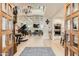 Open-concept living area with hardwood floors, a fireplace, a grand piano, and a stylish chandelier at 77 E Missouri Ave # 7, Phoenix, AZ 85012