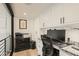 Home office with custom built-in cabinets, granite countertops and ample workspace at 77 E Missouri Ave # 7, Phoenix, AZ 85012