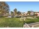 Scenic view of the pond featuring lush greenery, trees, and inviting bench at 77 E Missouri Ave # 7, Phoenix, AZ 85012