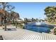 Beautiful pond with fountain, dock, and nearby condos offer an outdoor oasis for residents to enjoy the community at 77 E Missouri Ave # 7, Phoenix, AZ 85012