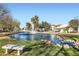 Scenic view of the pond and fountain, set among lush greenery and trees at 77 E Missouri Ave # 7, Phoenix, AZ 85012