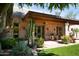 Charming patio area with lush greenery and well-manicured landscaping at 8022 N Ironwood Dr, Paradise Valley, AZ 85253