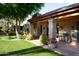 Outdoor living space with covered patio and meticulously maintained landscaping at 8022 N Ironwood Dr, Paradise Valley, AZ 85253