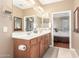 Bathroom boasts double sinks and a view into the main bedroom at 81 W Sundance Ct, San Tan Valley, AZ 85143